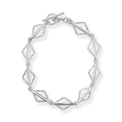 A silver geometric link bracelet with a toggle clasp, featuring alternating polished and textured diamond-shaped links, shown on a clean white background.
