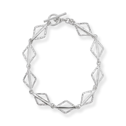 A silver geometric link bracelet with a toggle clasp, featuring alternating polished and textured diamond-shaped links, shown on a clean white background.