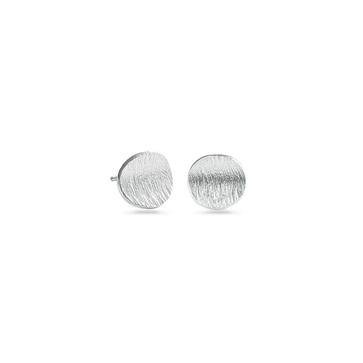 Round sterling silver studs on a white background