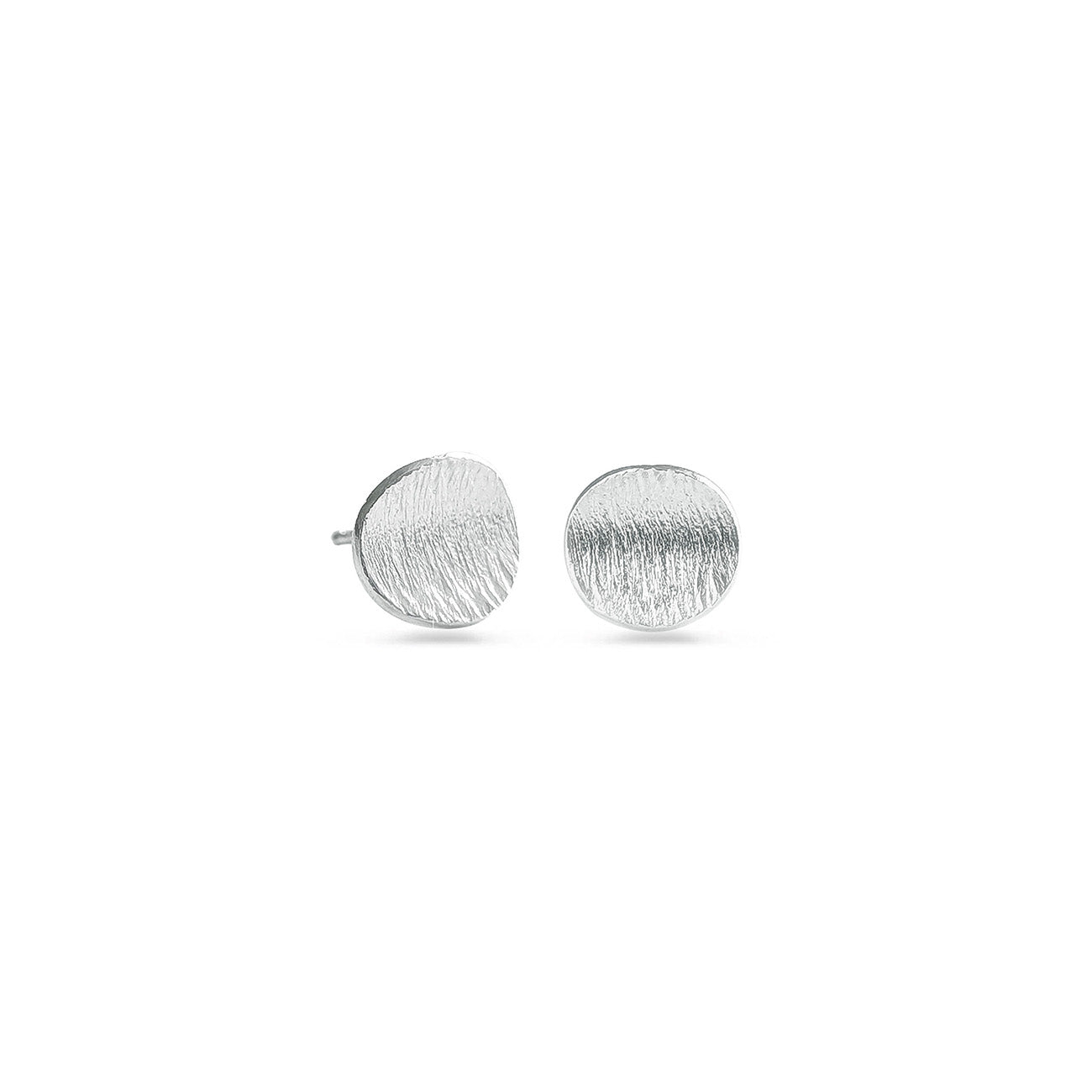 Round sterling silver studs on a white background