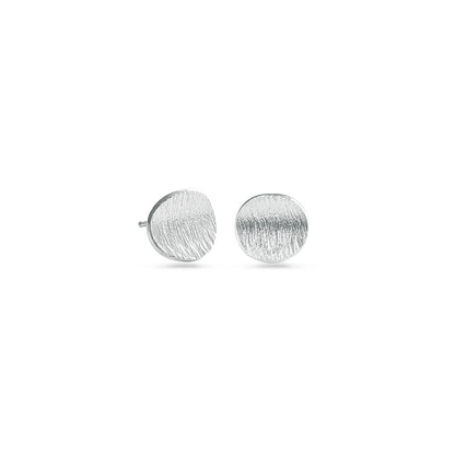 Round sterling silver studs on a white background
