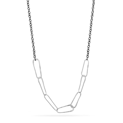 Silver chain necklace on a white background