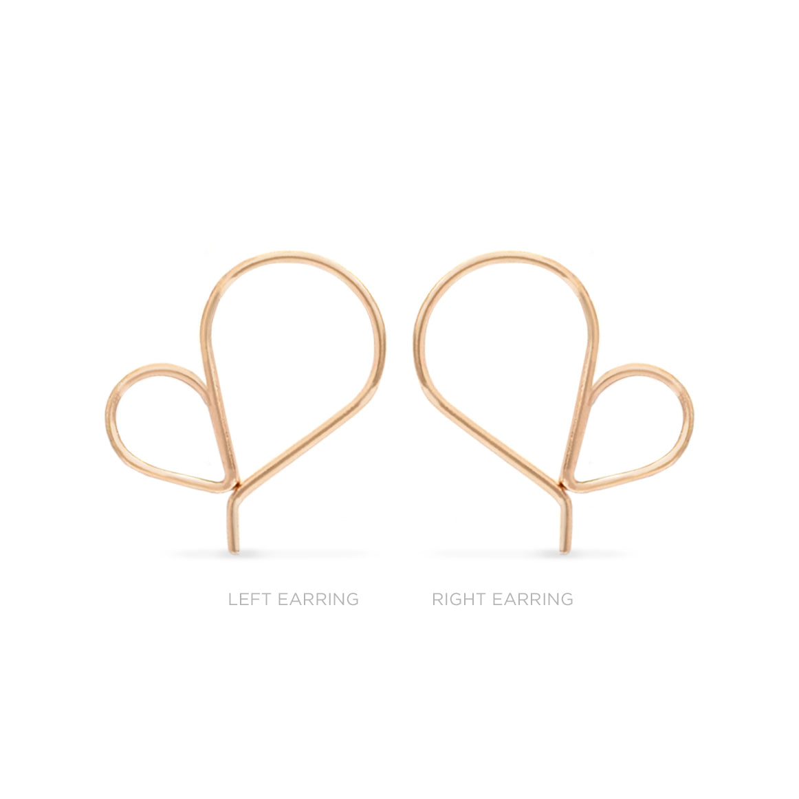 Pair of single rose gold heart shaped hoop earrings on a white background