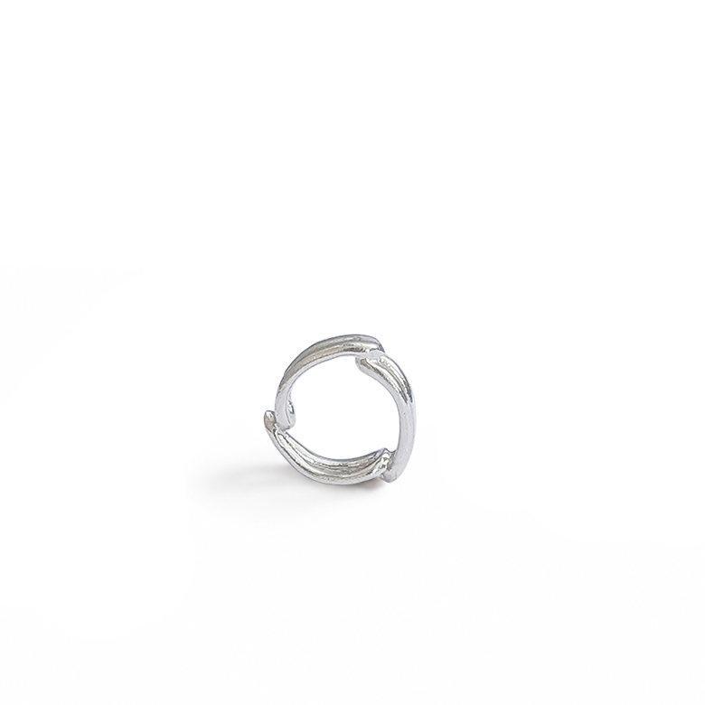 Sterling silver open ring spacer charm on white background