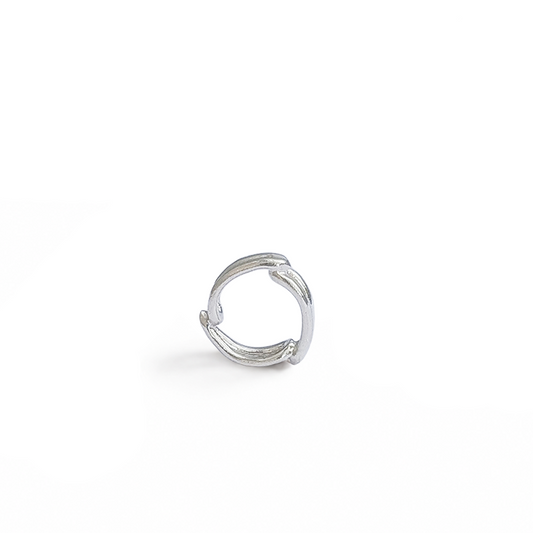 Sterling silver open ring spacer charm on white background