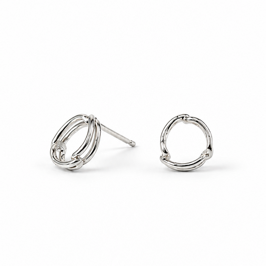 A pair of sterling silver open round circle stud earrings on a clean white background.