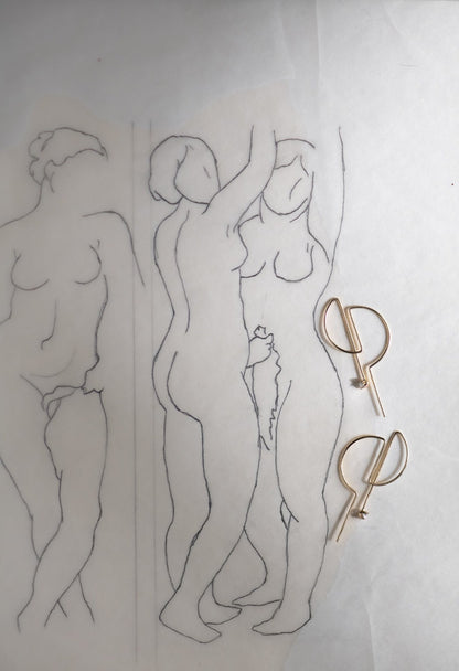 14K gold D hoop earrings with artist line drawing