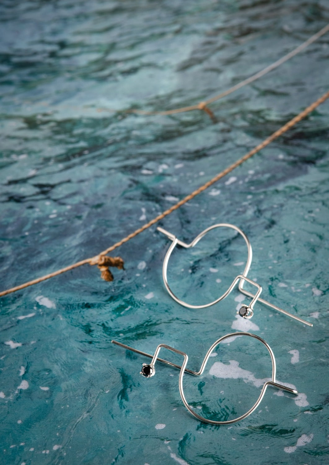 Delicate round white moissanite hoop earrings