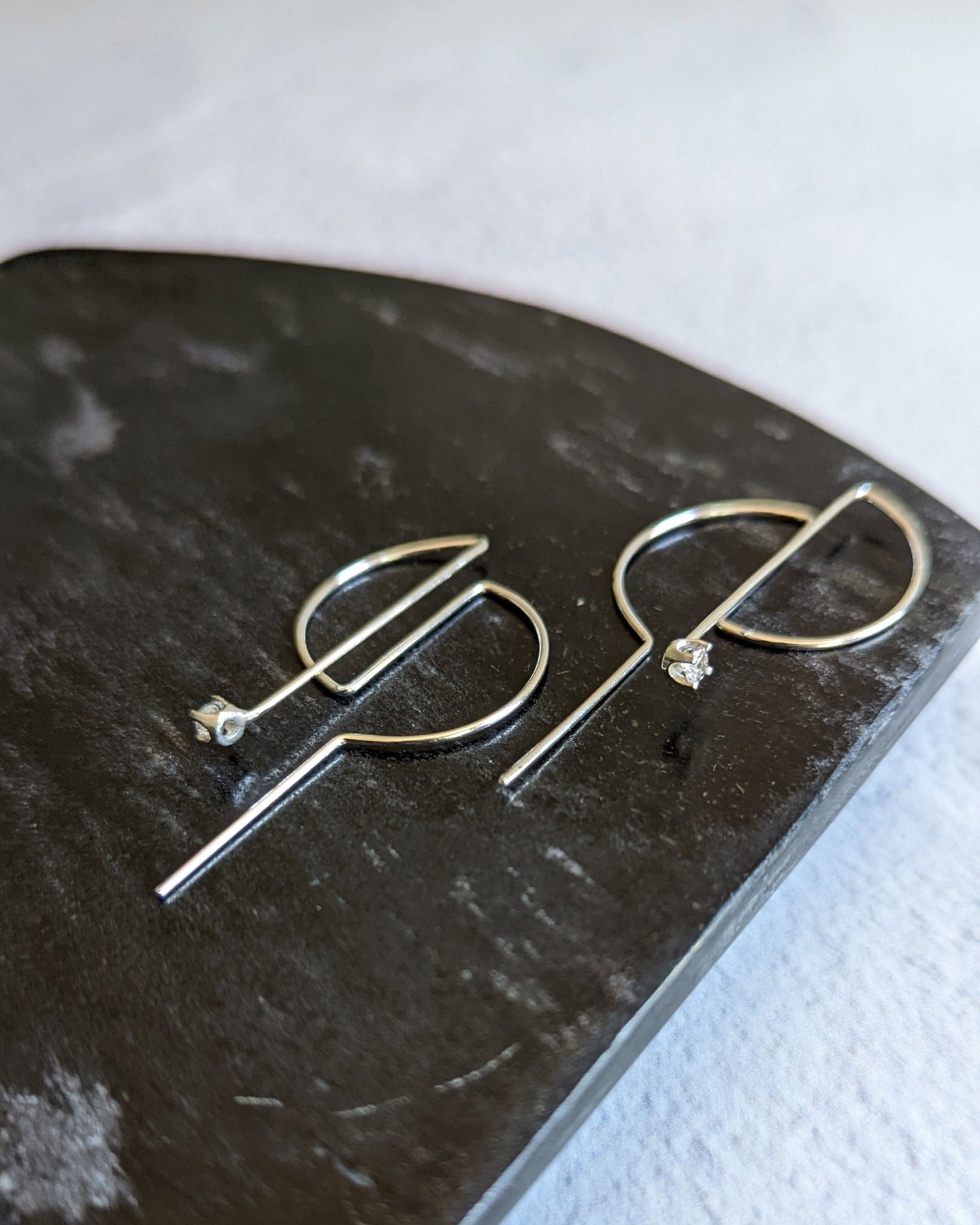 Silver D earrings with diamonds