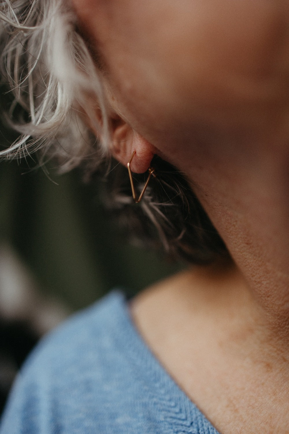 dainty dagger point wire earrings styled by a model