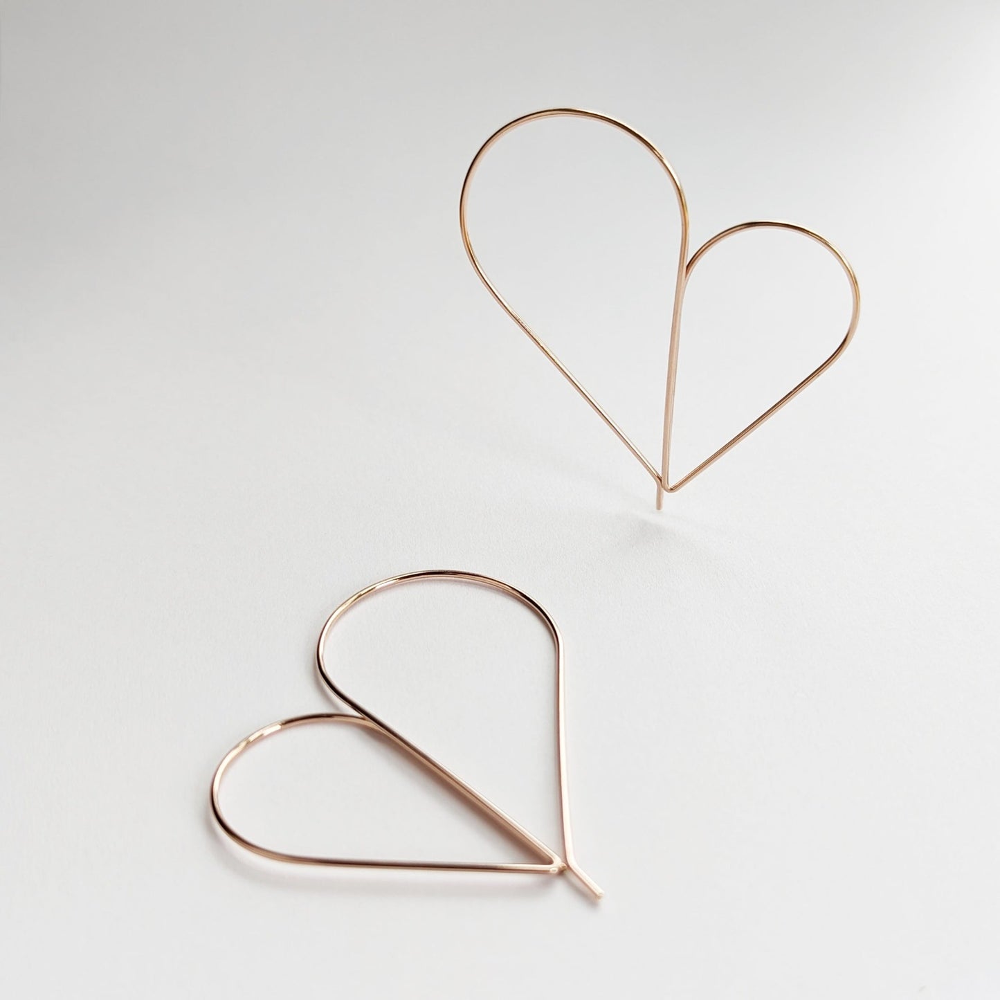 Rose gold wire heart hoop earrings