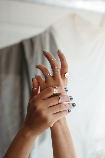 Stacking midi rings in sterling silver styled on model