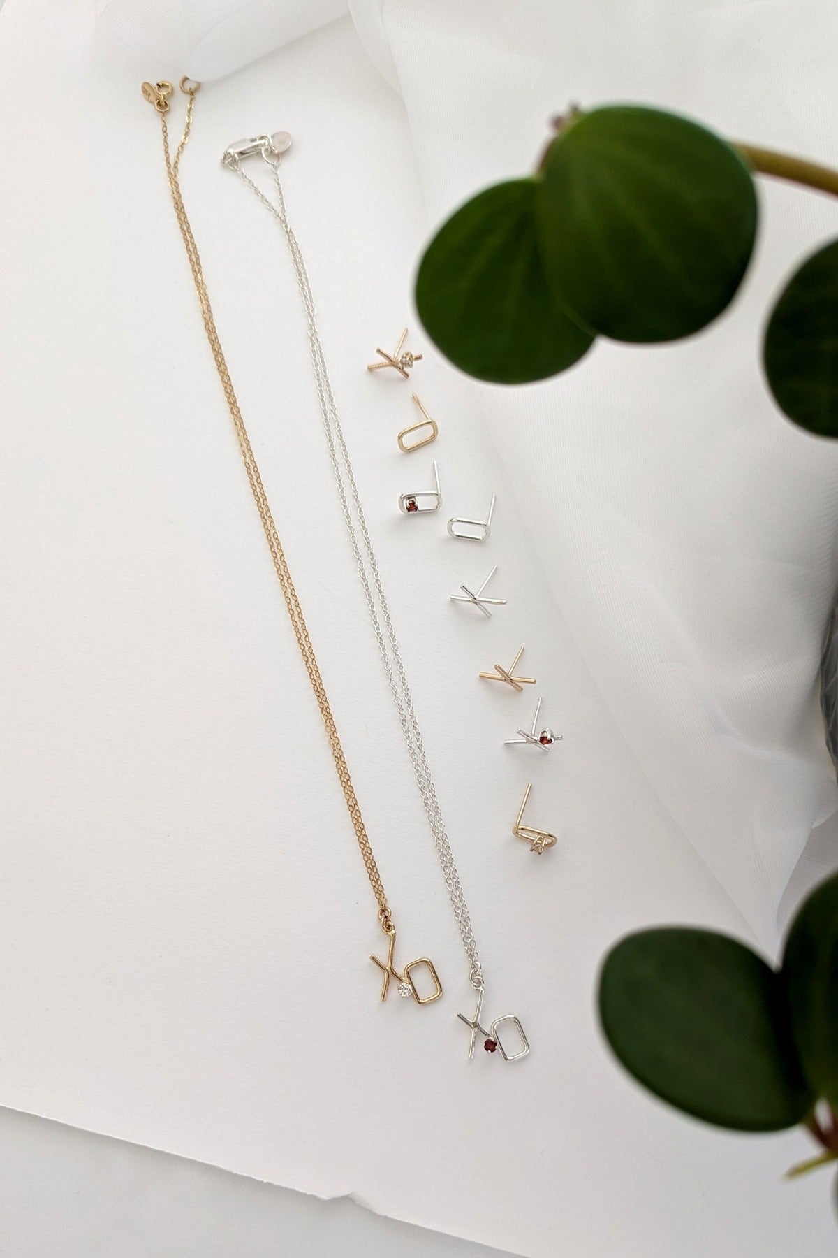 Valentines day inspired jewelry XO necklace and studs with garnets and diamonds