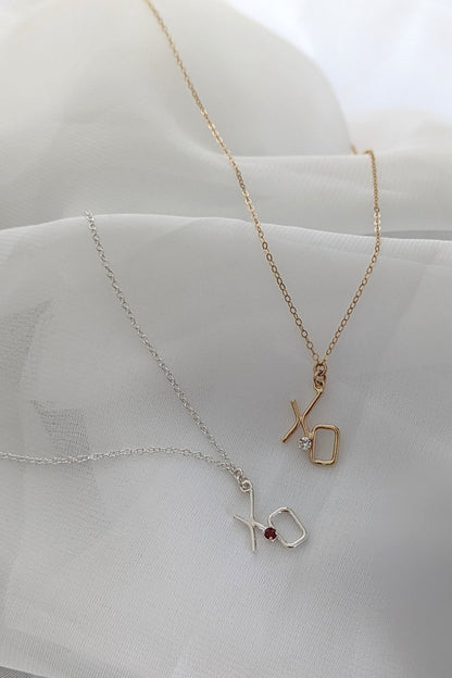 XO diamond and garnet necklaces in 14K gold and sterling silver